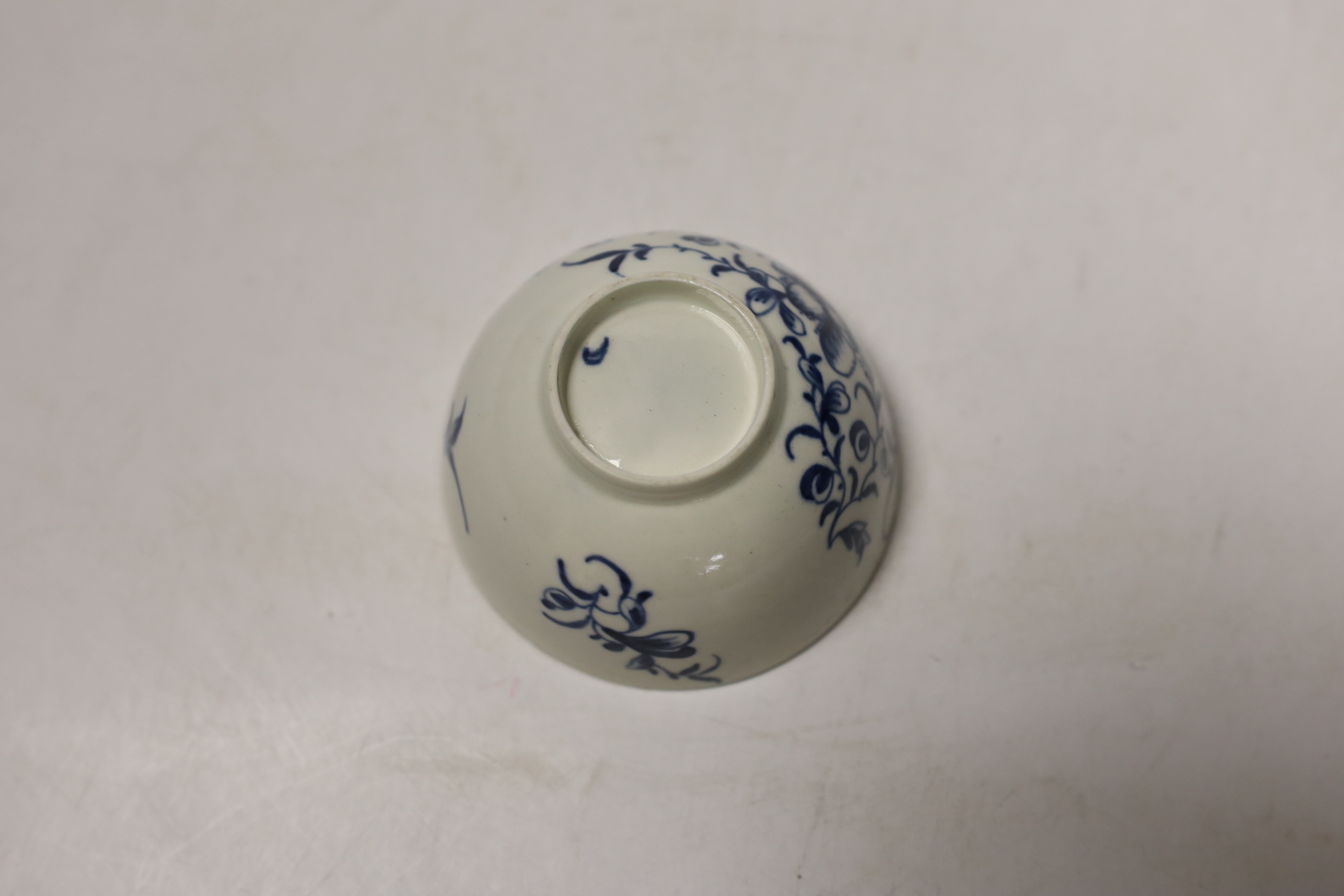 A Worcester tea bowl, Mansfield pattern and a saucer, Fruit and Flower pattern